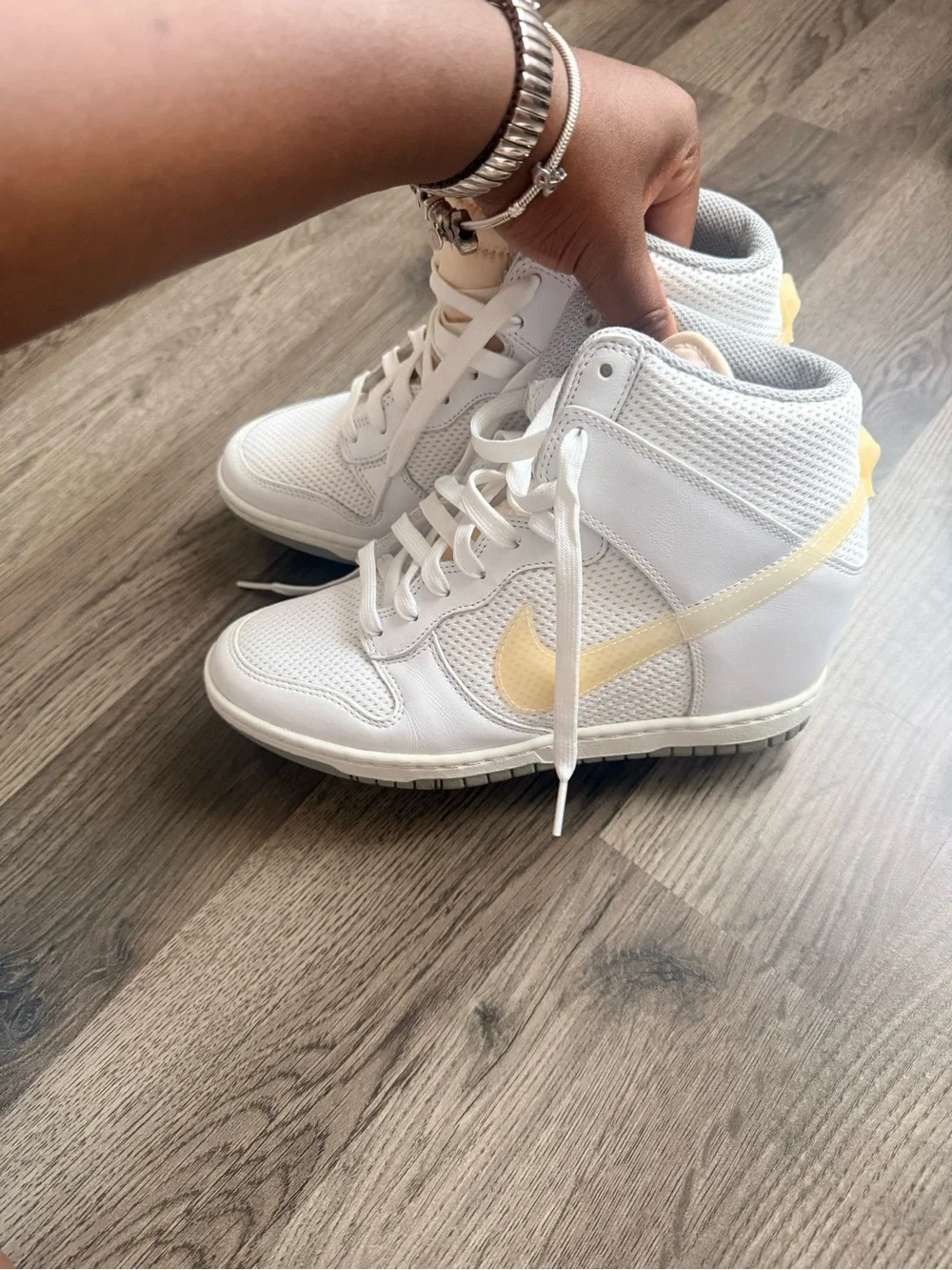 Nike White High-Top Sneakers with Pale Yellow Swoosh